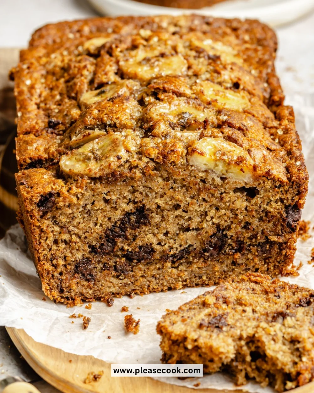 Healthy banana bread freshly baked, nutritious ingredients on display.