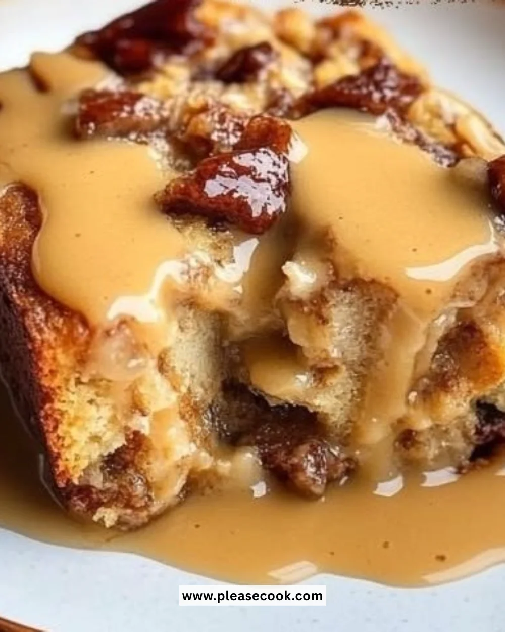 Delicious Hot Buttered Rum Bread Pudding topped with a rich sauce