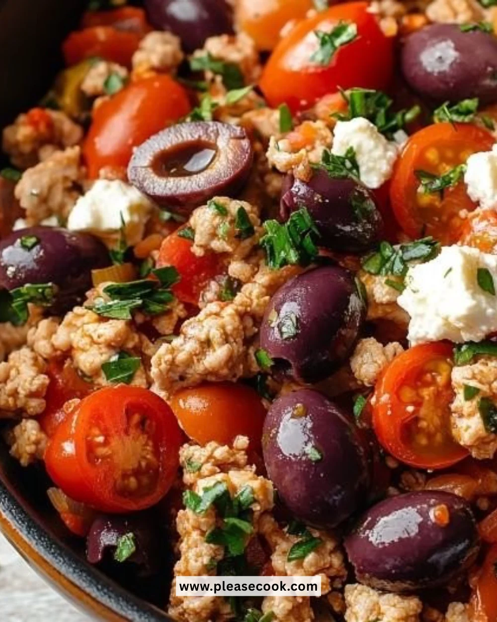 Mediterranean Keto Skillet with ground chicken, olives, and feta cheese in a skillet