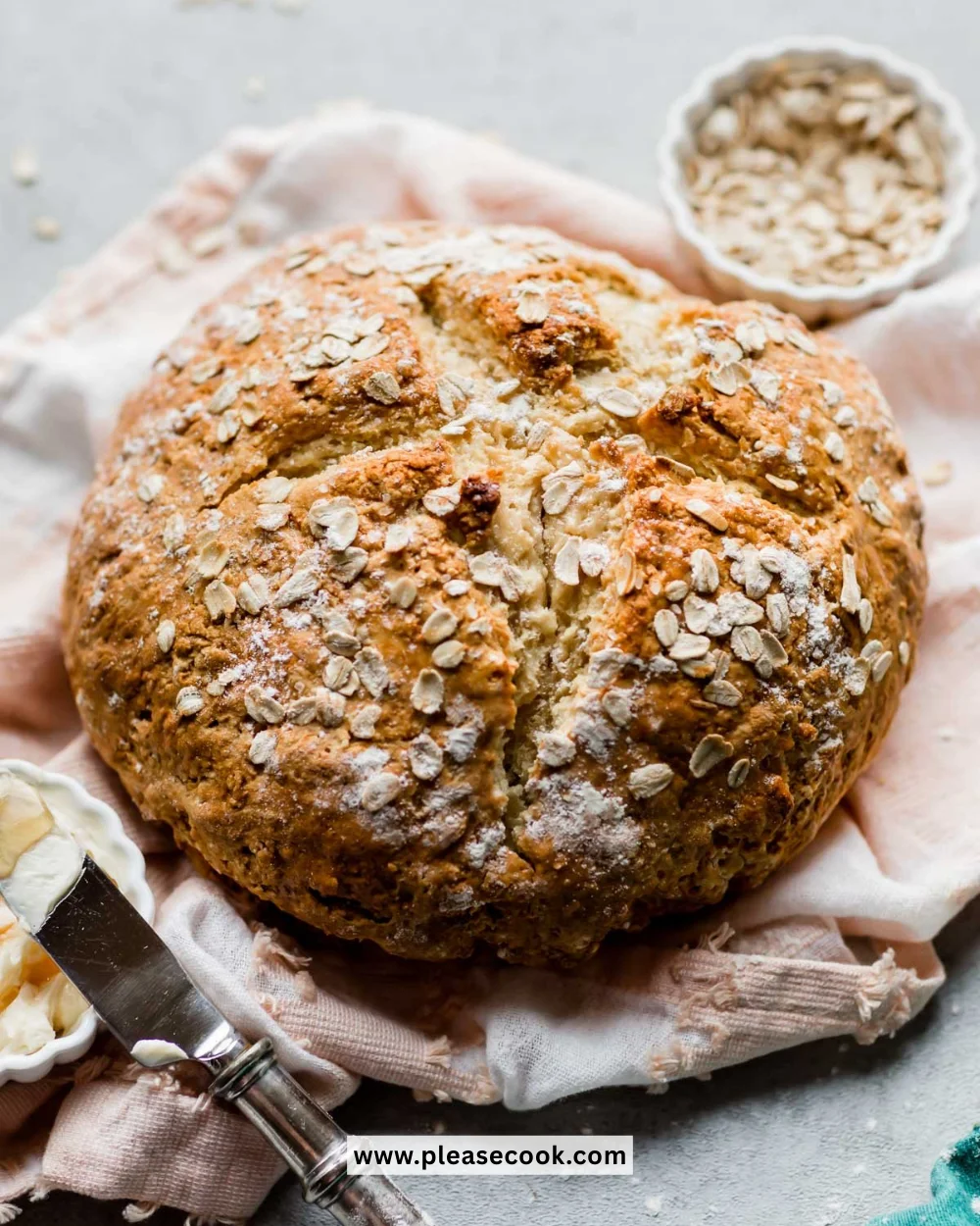 Freshly baked no yeast bread on a wooden table, showcasing its golden crust.