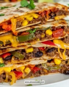 Delicious sheet pan beef quesadillas served on a wooden table