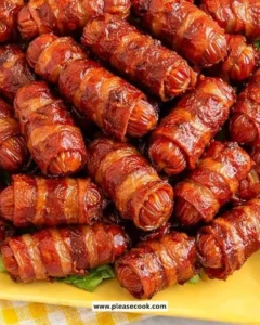 Delicious brown sugar bacon wrapped smokies served on a platter.