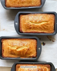 Delicious sweet cornbread served warm with butter on a wooden table