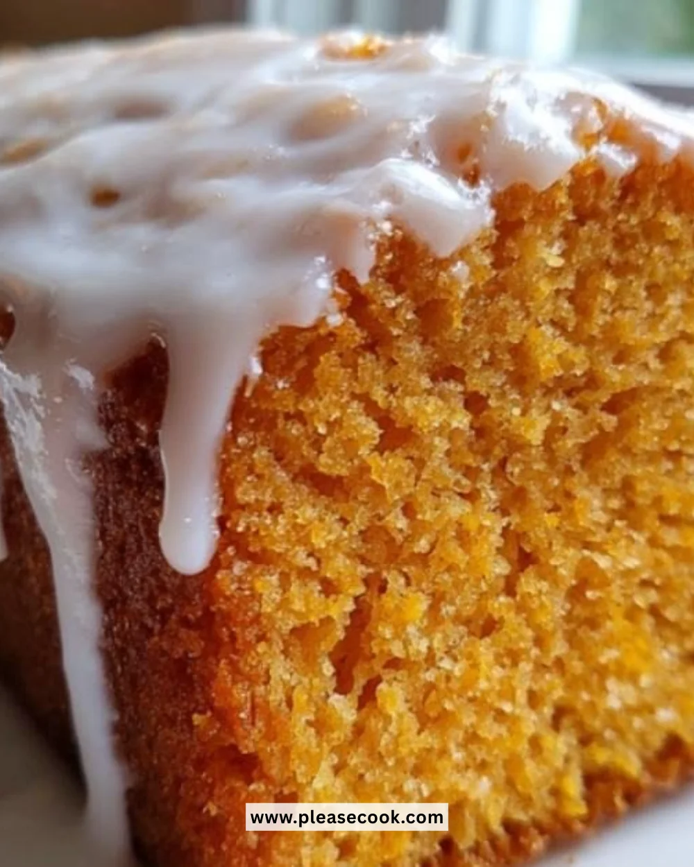 Slice of ultra-moist sweet potato pound cake on a plate with a fork
