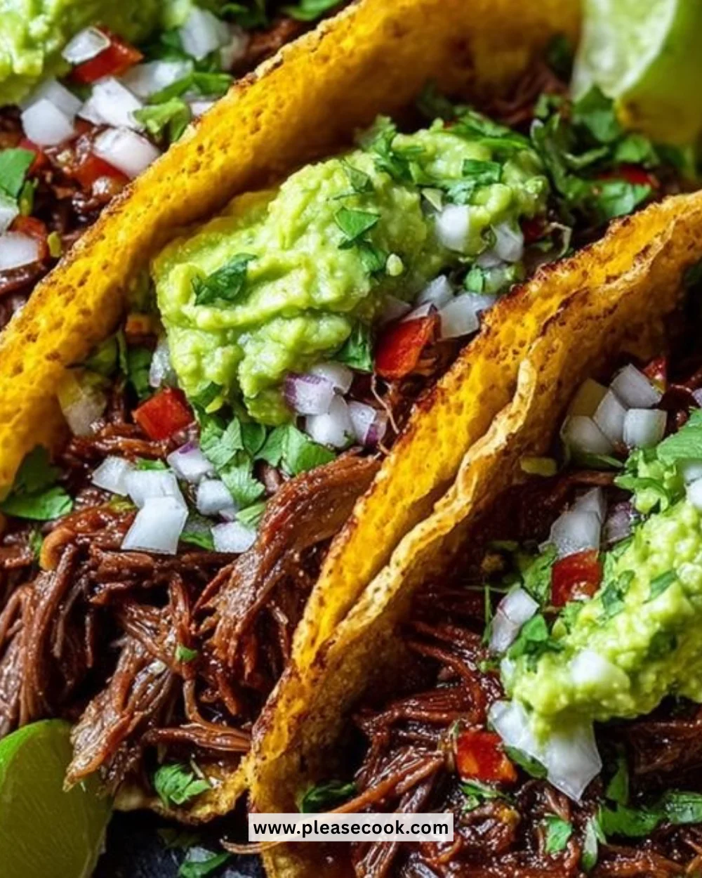 Delicious crispy shredded beef tacos topped with fresh guacamole.