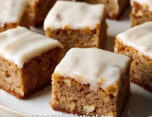 Delicious banana bread brownies topped with chocolate and banana slices