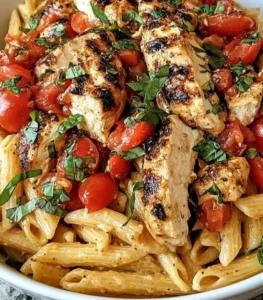 Delicious Bruschetta Chicken Pasta with fresh tomatoes and basil served in a bowl