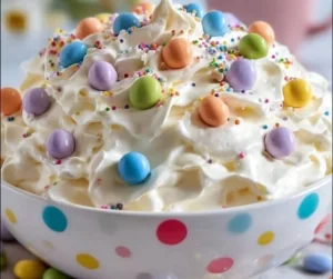 Easter-themed dessert made with Marshmallow Fluff, decorated with colorful candy eggs.