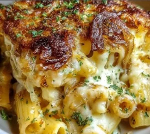 Delicious French Onion Pasta Bake topped with melted cheese and crispy onions.