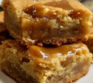 Plate of homemade Grandma's Chewy Butterscotch Blondies with chocolate drizzle