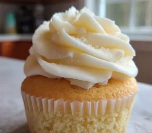 Moist vanilla cupcakes topped with creamy frosting and sprinkles