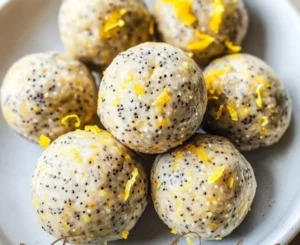 No-bake lemon poppyseed protein balls on a white plate