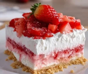 Delicious no bake strawberry lasagna dessert with layers of cream and strawberries.