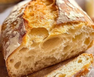 Freshly baked No Knead Italian Artisan Bread on a wooden table.