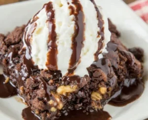 Delicious Peanut Butter Cup Dump Cake topped with chocolate and peanut butter cups