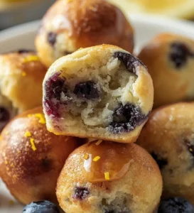 Delicious blueberry lemon pancake bites served on a plate.