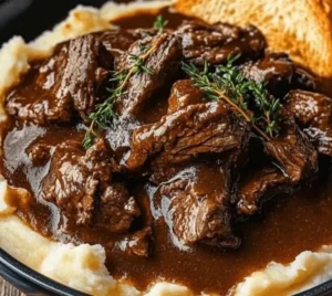 Delicious slow cooker beef Manhattan served on a plate with vegetables.