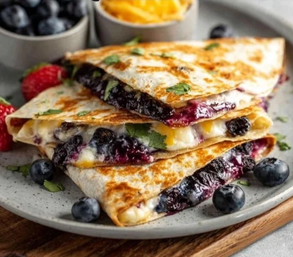 Blueberry breakfast quesadilla loaded with fresh blueberries and cheese
