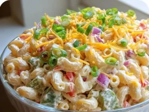 Delicious creamy macaroni salad in a vibrant bowl, perfect for gatherings.