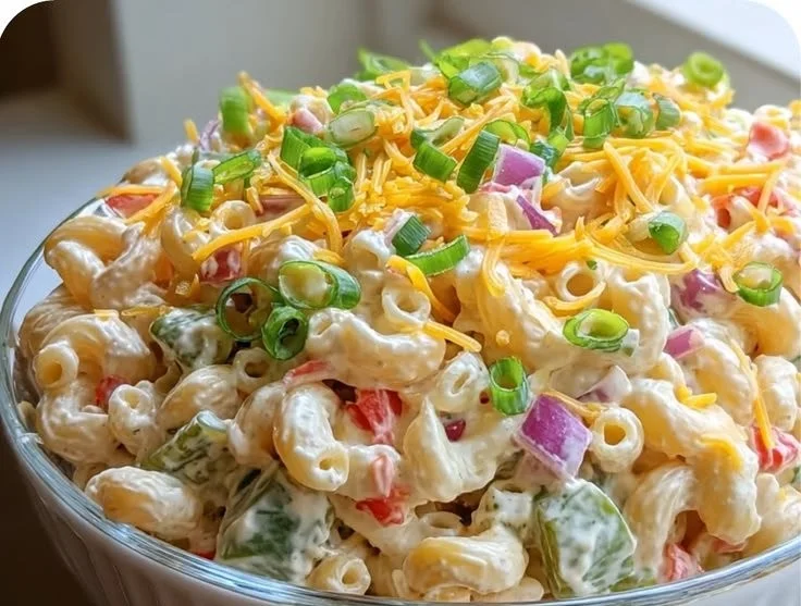 Delicious creamy macaroni salad in a vibrant bowl, perfect for gatherings.