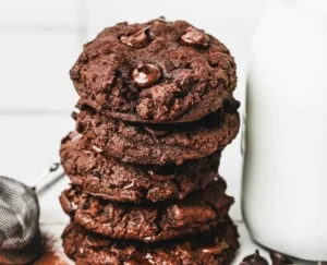 Delicious double chocolate chip cookies stacked on a plate