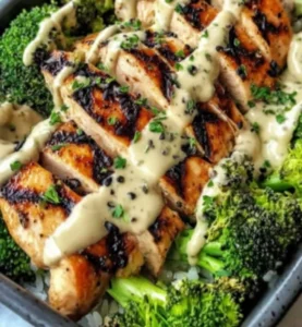 Grilled chicken broccoli bowls topped with vibrant vegetables and sauce