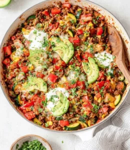 Ground beef and zucchini skillet dish served in a frying pan