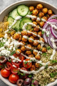 Mediterranean quinoa and chickpea bowls with fresh vegetables and herbs