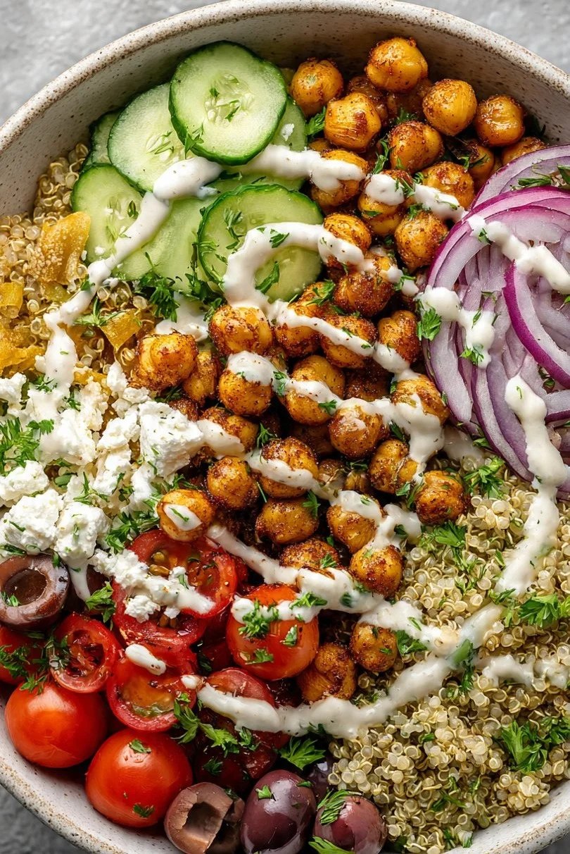 Mediterranean quinoa and chickpea bowls with fresh vegetables and herbs