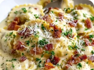 Delicious plate of Olive Garden Ravioli Carbonara topped with creamy sauce and herbs