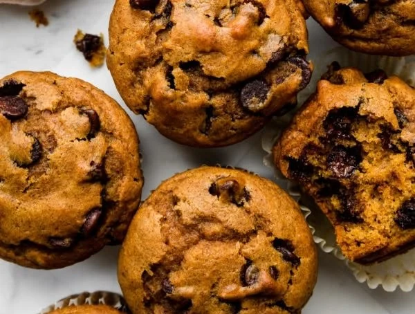 Homemade pumpkin muffins fresh out of the oven, ready to be enjoyed.