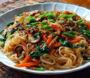 Delicious rice noodle stir-fry with colorful vegetables and protein.