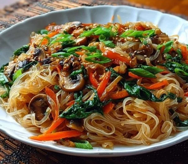 Delicious rice noodle stir-fry with colorful vegetables and protein.
