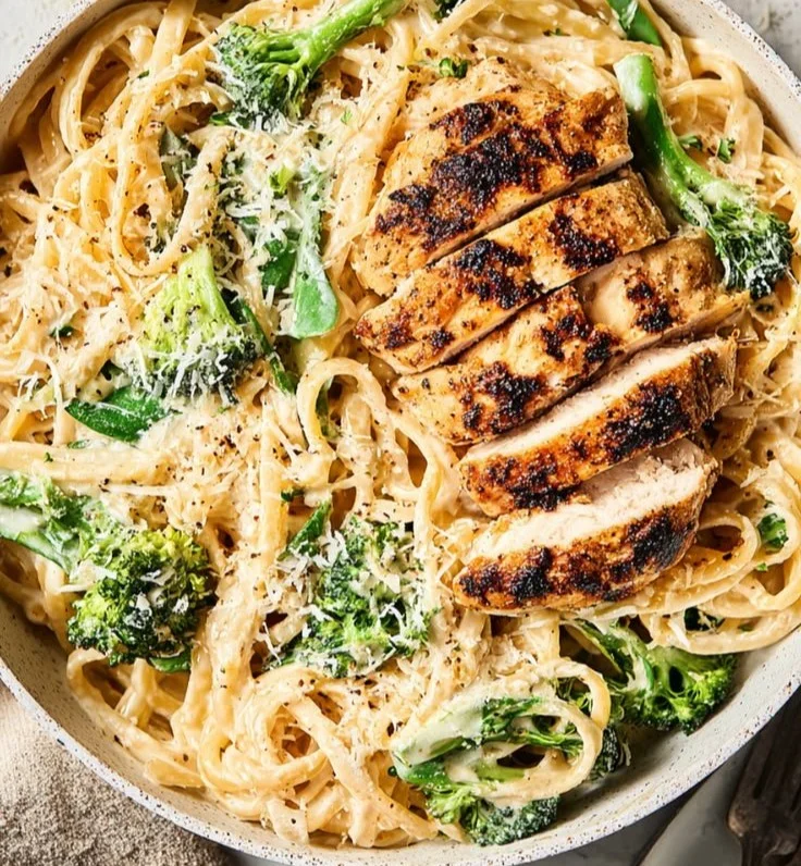 Healthy Skinny Chicken Broccoli Alfredo dish with creamy sauce and vegetables