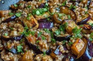 Smoky Eggplant and Farro Skillet prepared in a cast iron pan