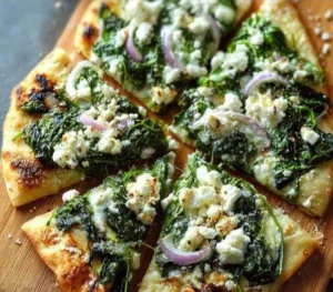 Delicious spinach feta flatbread pizza with fresh ingredients and crispy crust