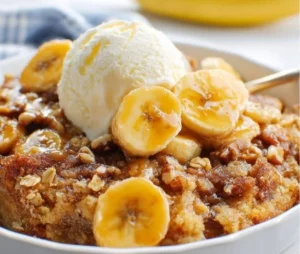 Delicious homemade Banana Cobbler served with a scoop of vanilla ice cream