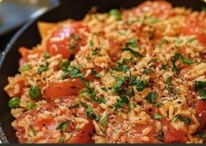 Delicious Turkey Tomato Rice Skillet served in a bowl with fresh herbs on top.