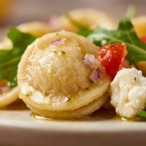 Delicious Orecchiette Pasta Salad served in a bowl with fresh vegetables.